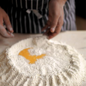 image of jamie oliver making pasta dough by hand